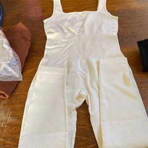 Size large white/cream romper, brand new. Would fit medium as well. Super cute